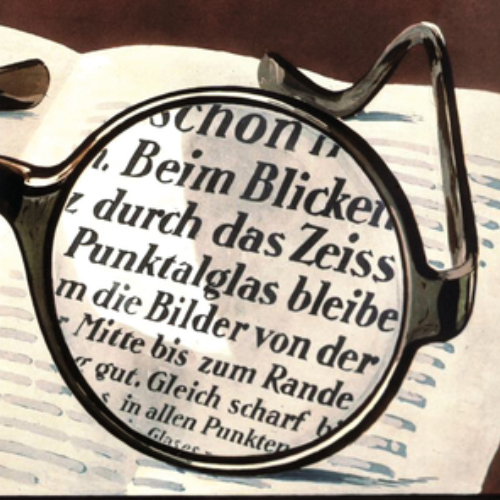 O imagine cu o reclamă veche de lentile ZEISS Punktal care prezintă o vedere clară prin întreaga lentilă. Acest lucru a fost revoluționar în 1912. 