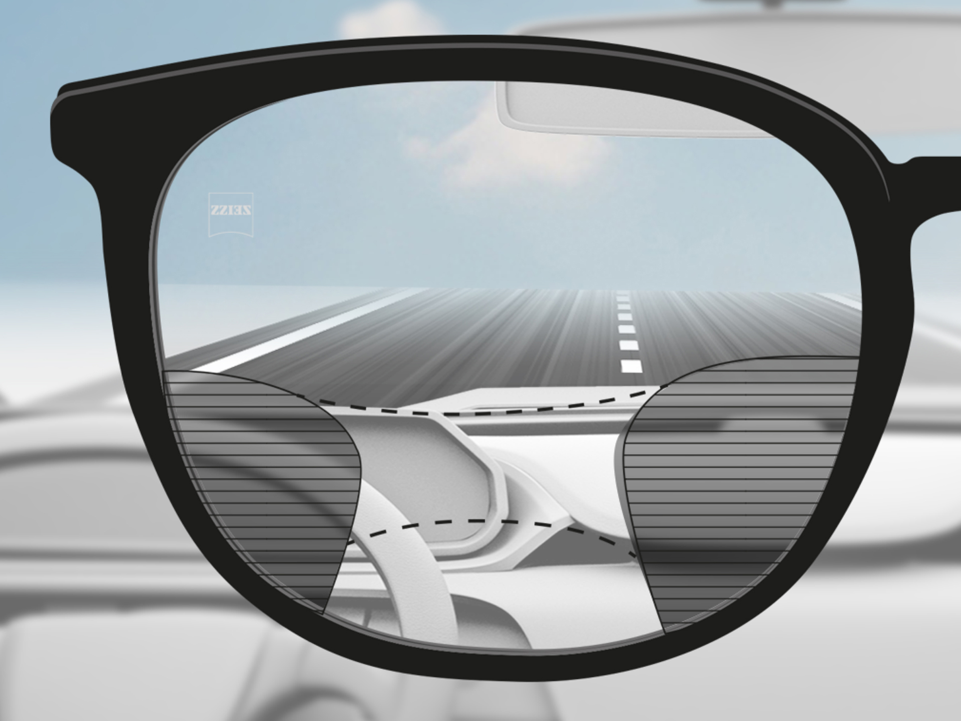 O imagine cu punct de vedere prin lentile progresive ZEISS DriveSafe: Zonele de vizibilitate sunt adaptate astfel încât șoferul să aibă zone de vizibilitate clare pe șosea și pe bord.