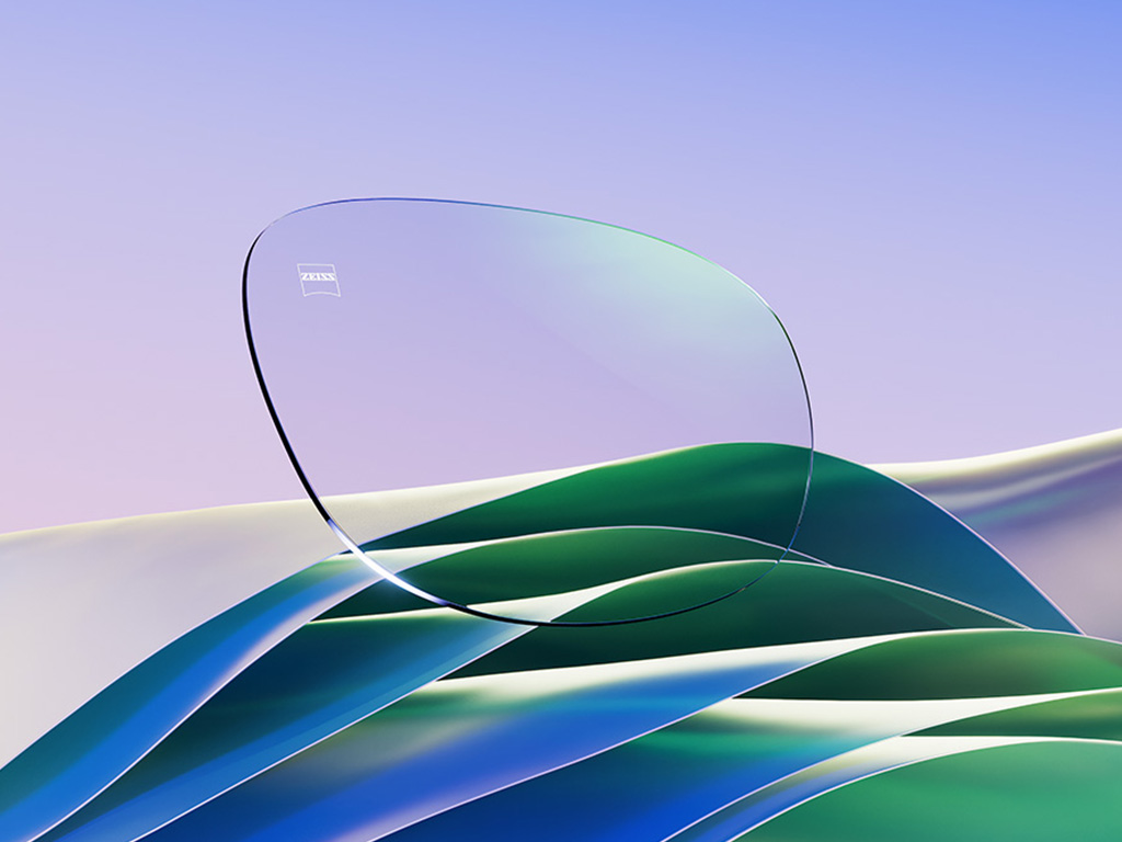 O reprezentare CGI a unor lentile incolore de ochelari de vedere cu un reflex verde subtil. 