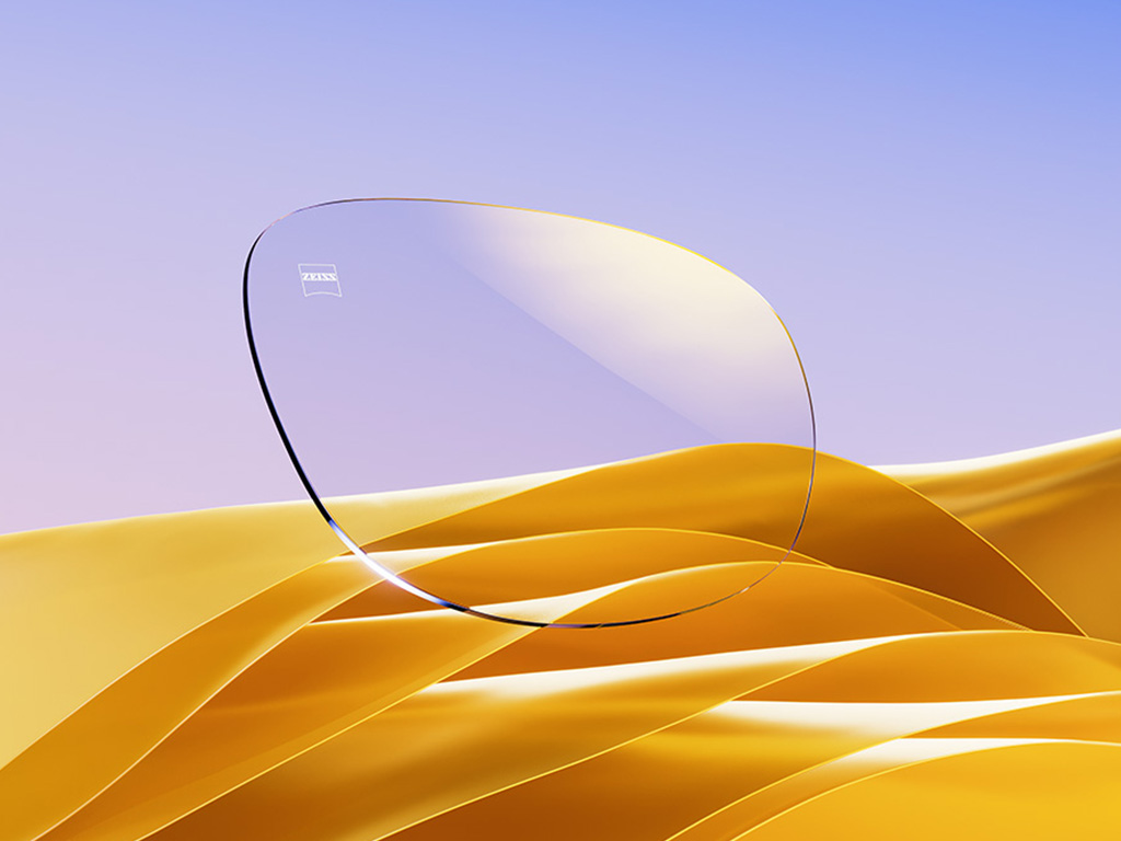 O reprezentare CGI a unor lentile incolore de ochelari de vedere cu un reflex auriu subtil.